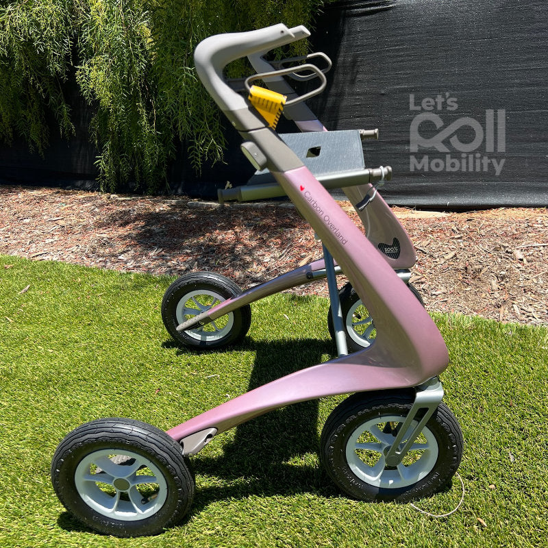 Rose Gold Pink byACRE Carbon Overland rollator in direct sunlight