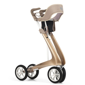 The champagne gold byACRE Ultralight Rollator in a folded position with the padded backrest fitted 